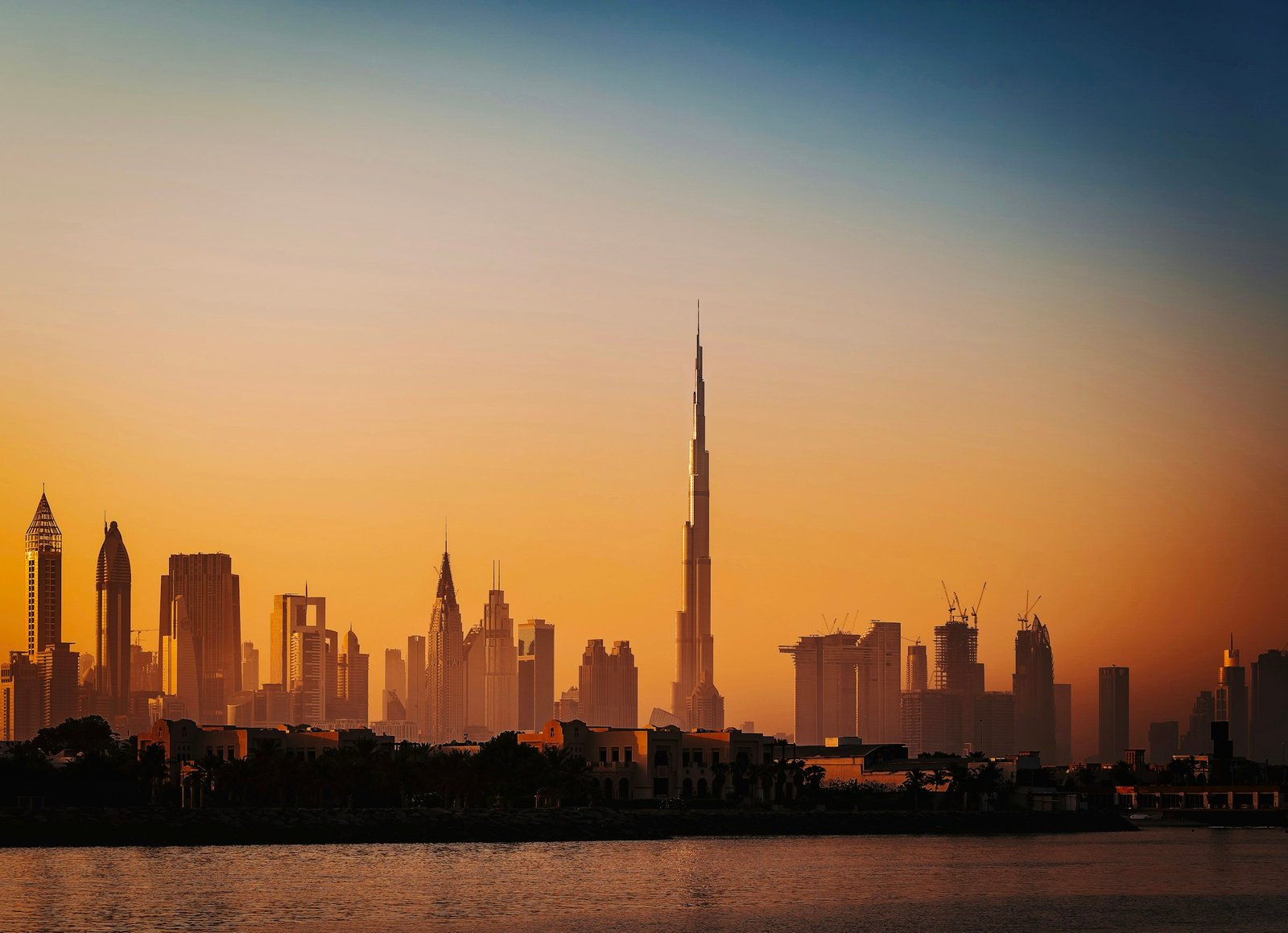 Dubai skyline across the water at sunset