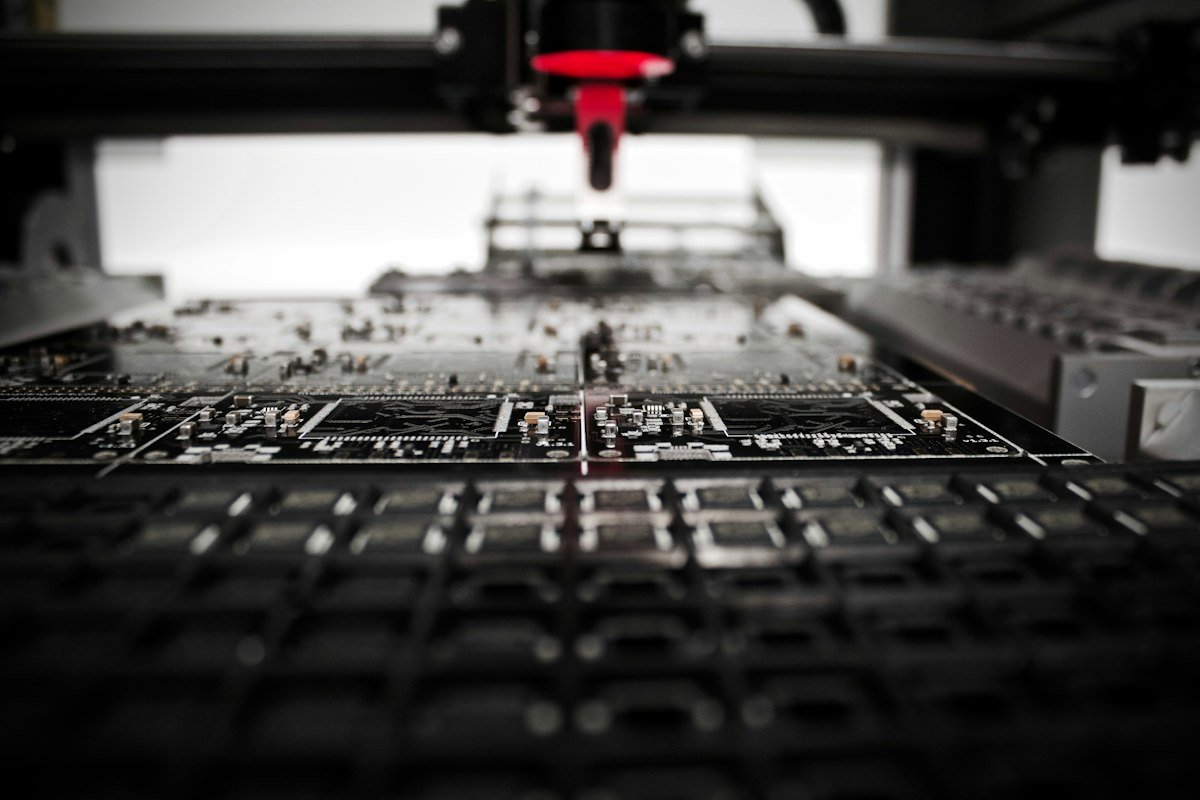 Robotic arm working above a circuit board