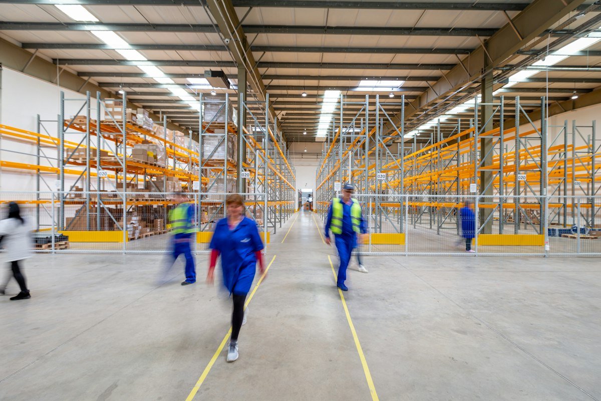 Warehouse aisle with shelves full of stock